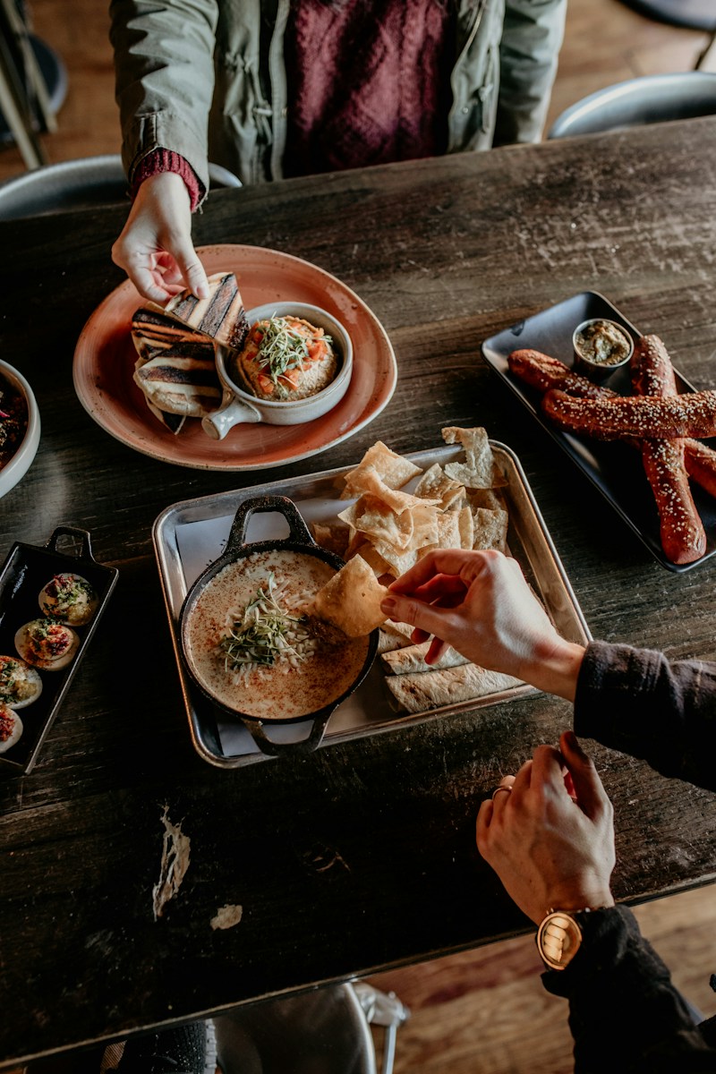 a person holding a plate of food