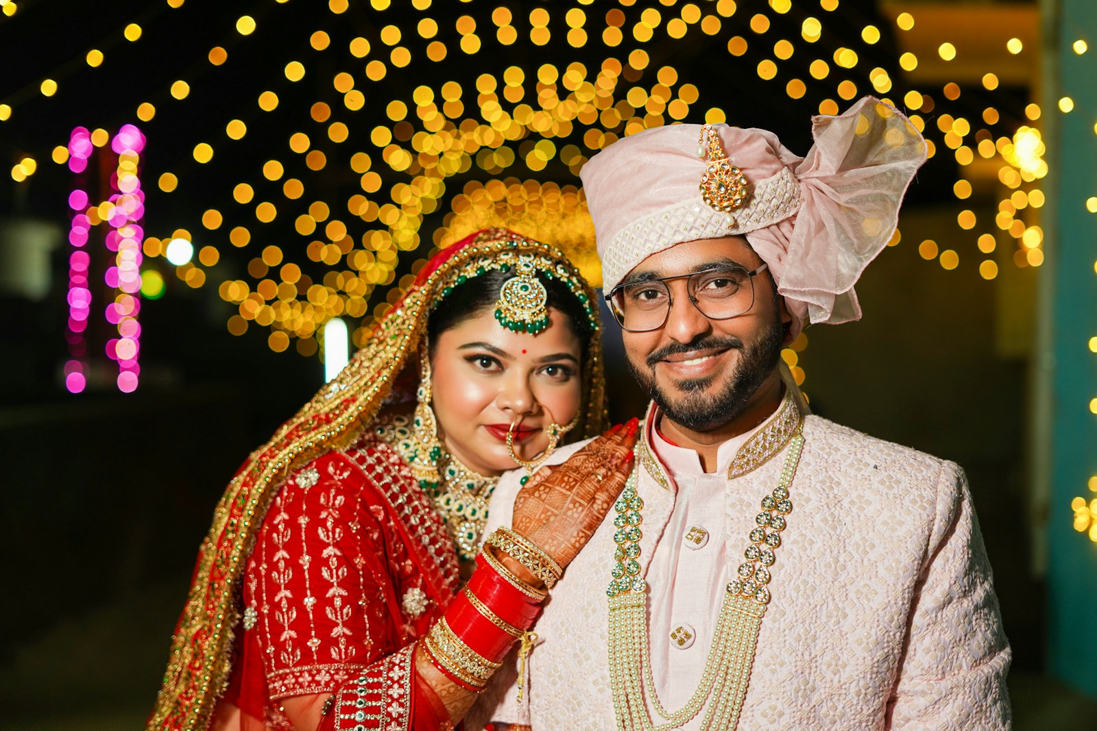 A bride and groom posing for a picture