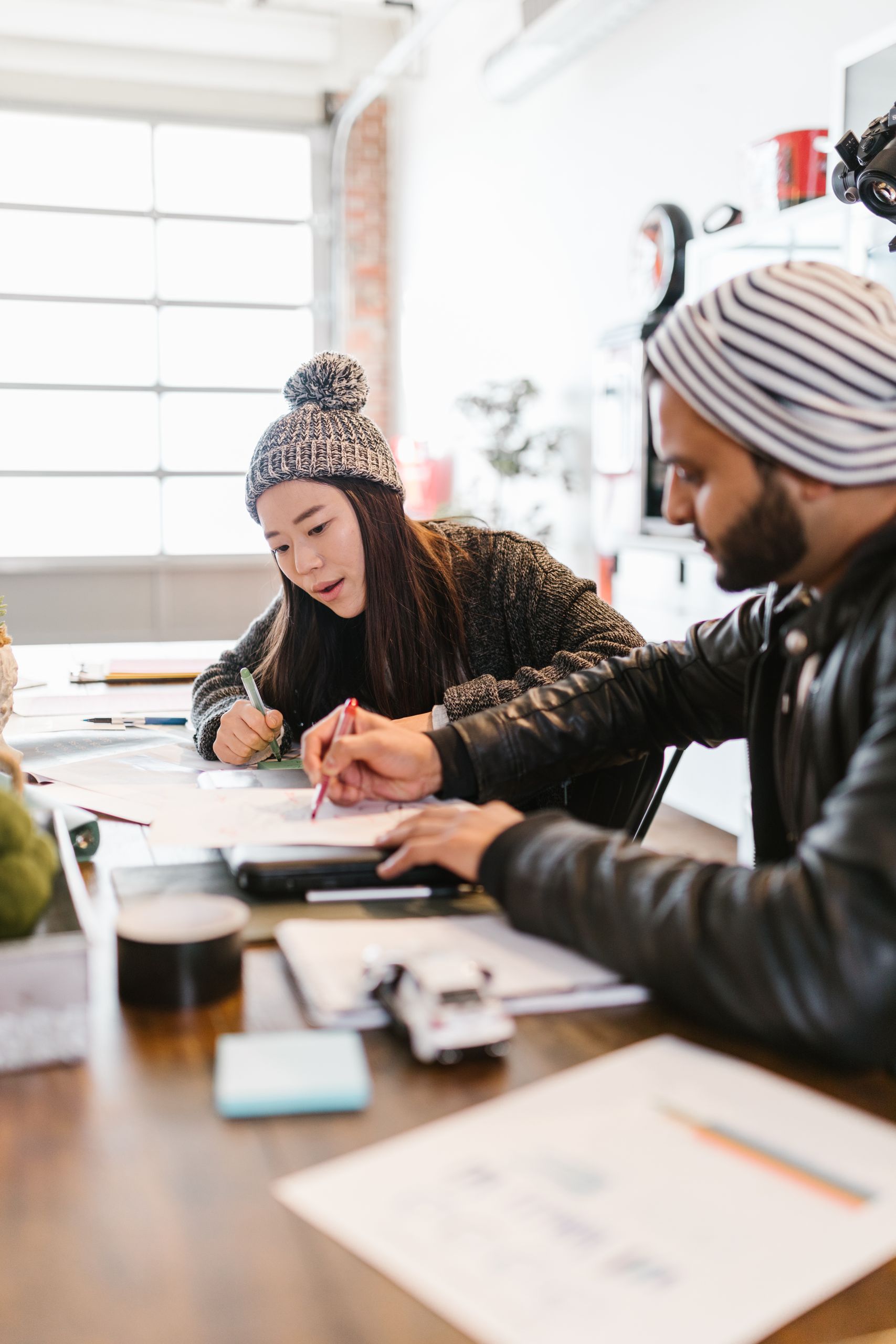 Two professionals working together in a contemporary office setting. Perfect teamwork vibe.