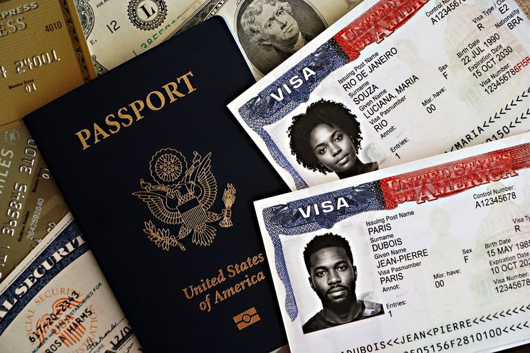 United States passport with visas and currency, showcasing travel essentials.