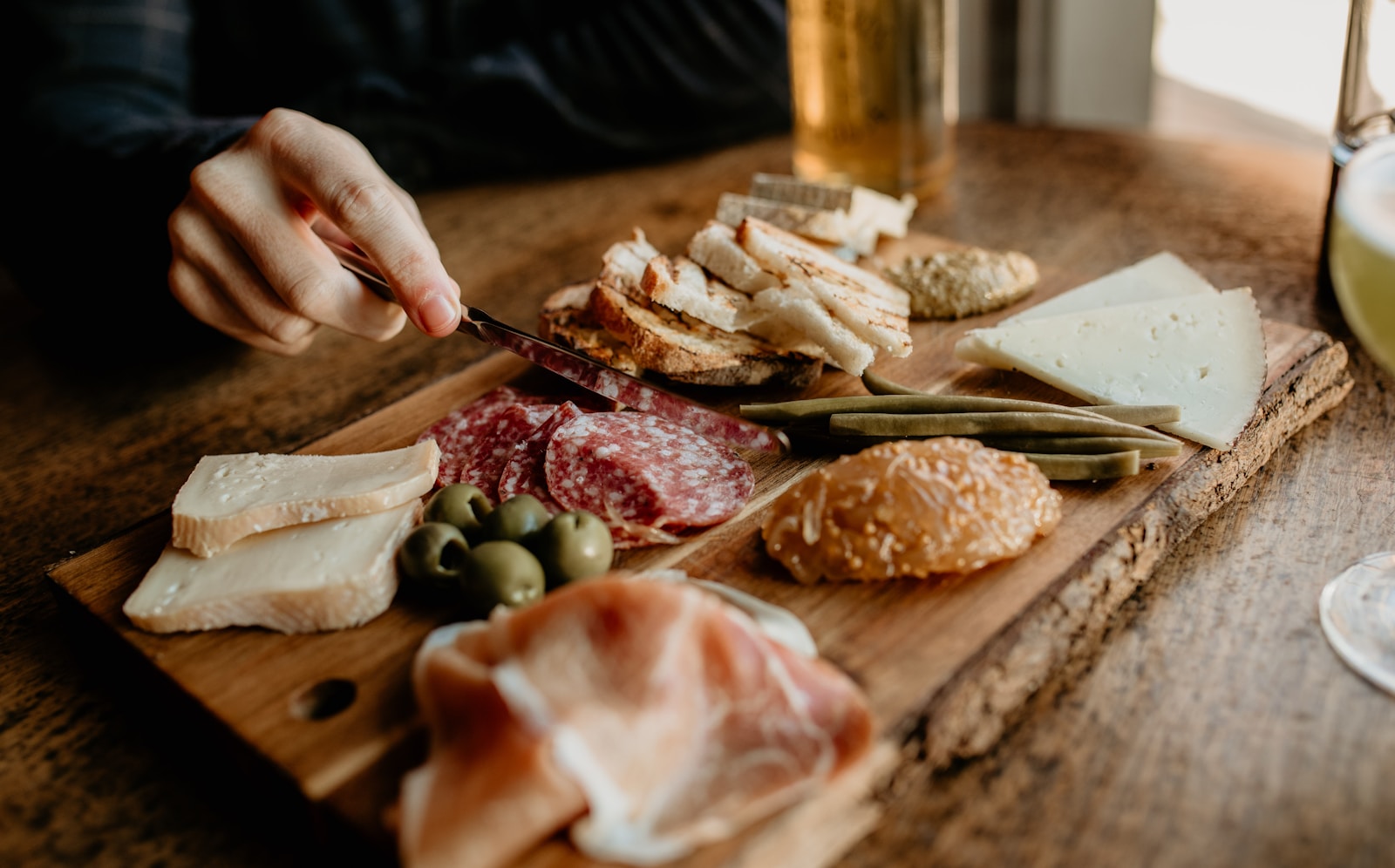 a person cutting meat