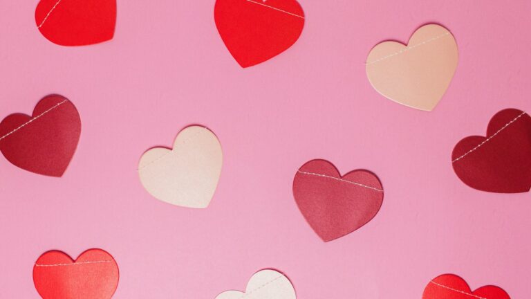 Pink and white paper hearts. Photo by Rinck Content Studio on Unsplash.