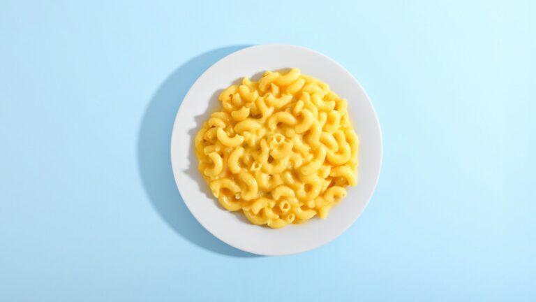 Mac and cheese on a white plate. Photo by Giorgio Trovato on Unsplash.