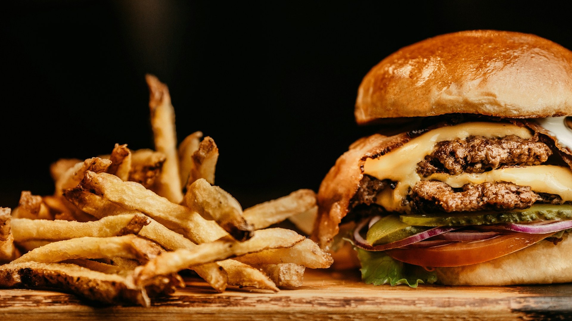 Unsplash photo by Jonathan Borba showing a burger with fries