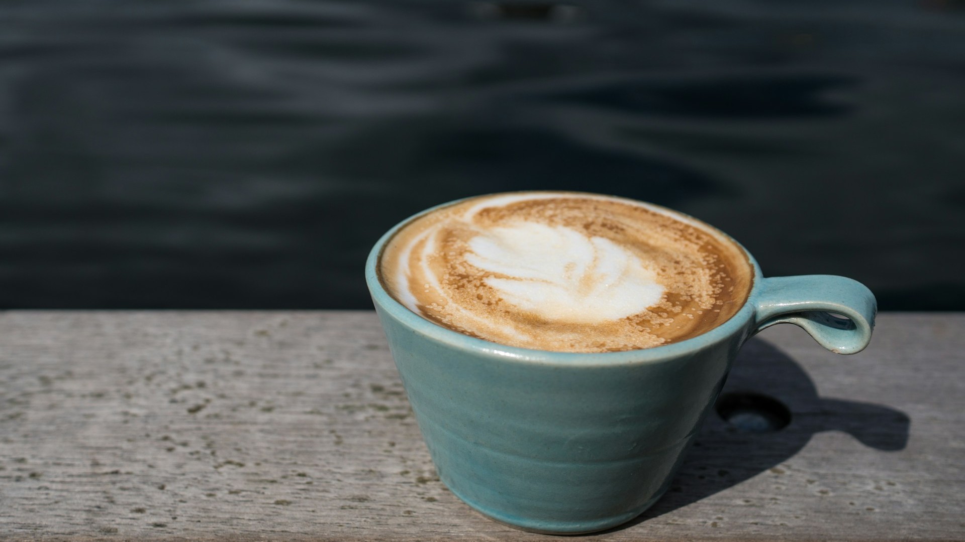 Unsplash photo by xyzcharlize showing a coffee latte in a mug