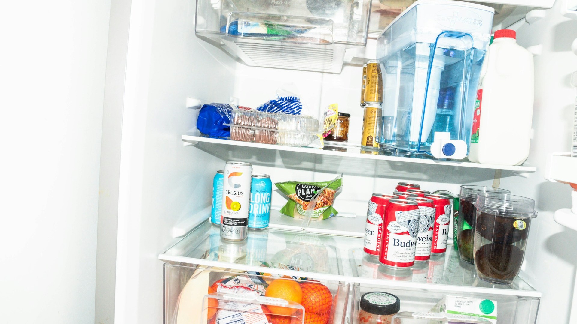 Unsplash photo by Matthew Moloney showing a refrigerator full of food and drinks